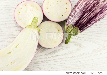 Fresh raw striped Eggplant on grey wood 42067250