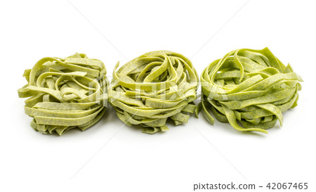 Raw fresh Fettuccine isolated on white Raw fresh Fettuccine isolated on white 42067465