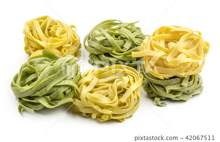 Raw fresh Fettuccine isolated on white Raw fresh Fettuccine isolated on white 42067511