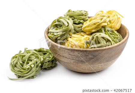Raw fresh Fettuccine isolated on white Raw fresh Fettuccine isolated on white 42067517