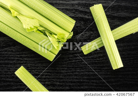 Fresh Celery isolated on black wood Fresh Celery isolated on black wood 42067567