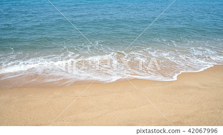 Summer background, calm surf on the shore 42067996