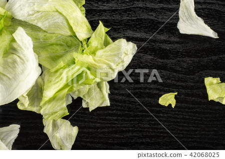 Fresh Raw Iceberg Lettuce on black wood 42068025