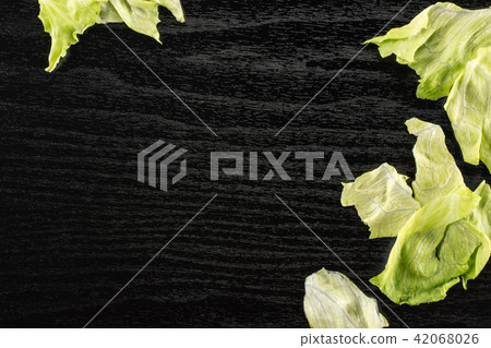 Fresh Raw Iceberg Lettuce on black wood 42068026