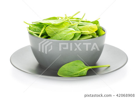 Fresh raw green spinach isolated on white Fresh raw green spinach isolated on white 42068908