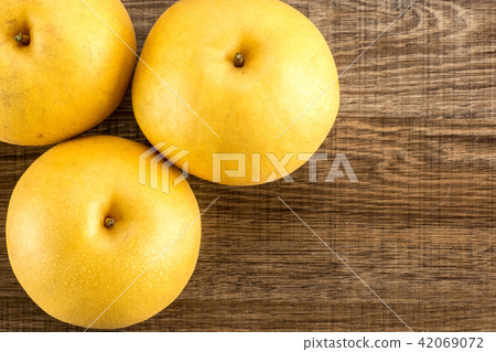 Fresh Nashi golden pear isolated on white Fresh Nashi golden pear isolated on white 42069072