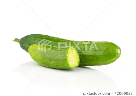 Fresh raw mini cucumber isolated on white Fresh raw mini cucumber isolated on white 42069082