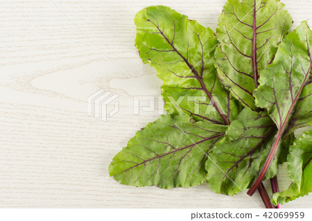 Fresh raw red beetroot on grey wood 42069959