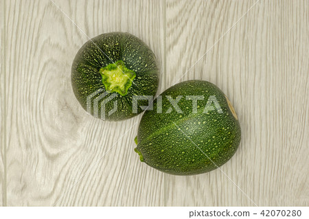 Fresh raw round Zucchini on grey wood 42070280