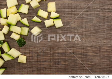 Fresh raw round Zucchini on brown wood 42070623
