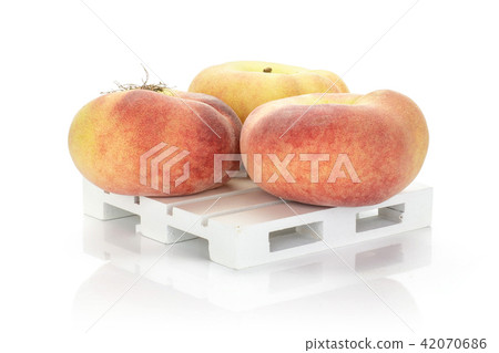 Fresh raw saturn peach isolated on white Fresh raw saturn peach isolated on white 42070686