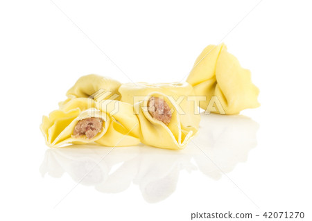 Fresh Raw tortellini pasta isolated on white Fresh Raw tortellini pasta isolated on white 42071270