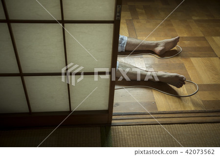Male foot lying in a Japanese style room 42073562