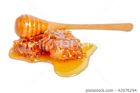 Honeycomb and honey isolated on white background Honeycomb and honey isolated on white background 42076294