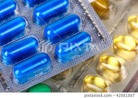 blue and yellow medical pills in blister blue and yellow medical pills in blister 42081887