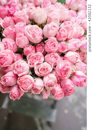light pink bush roses flowers in vase on wooden table. Beautiful summer bouquet. Arrangement with light pink bush roses flowers in vase on wooden table. Beautiful summer bouquet. Arrangement with 42082132