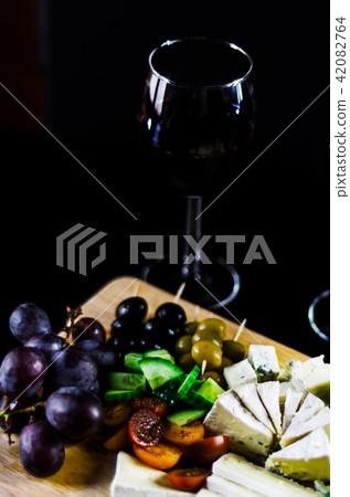 set of different cheeses on a wooden board 42082764
