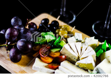 set of different cheeses on a wooden board 42082766
