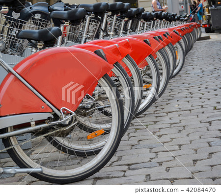 Row of bicycles for rent. Row of bicycles for rent. 42084470
