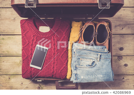 Open suitcase with casual female clothes Open suitcase with casual female clothes 42086969