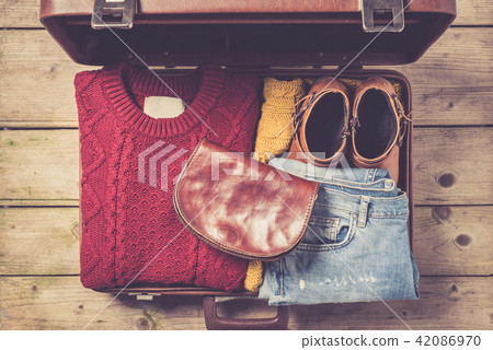 Open suitcase with casual female clothes Open suitcase with casual female clothes 42086970