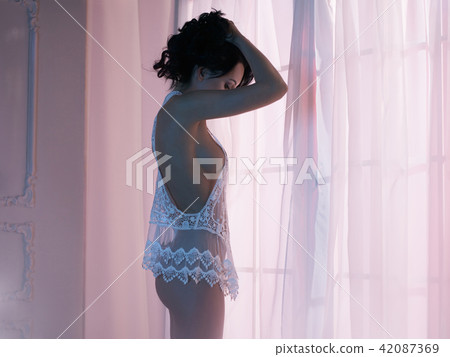 Woman in lingerie at window 42087369