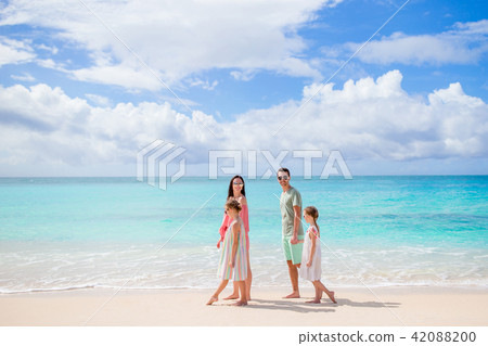 Young family on vacation on the beach. 42088200
