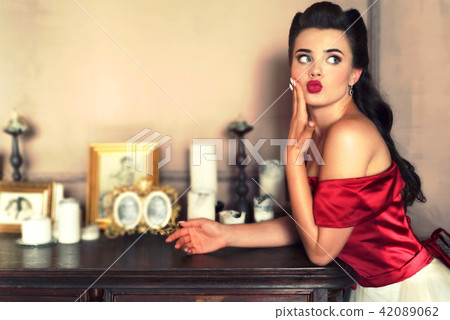 Pretty pin-up girl in retro interior Pretty pin-up girl in retro interior 42089062