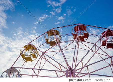 close up part of pastel ferris wheel on blue sky close up part of pastel ferris wheel on blue sky 42089066