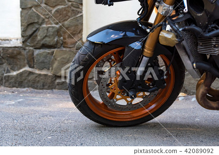 Modern sporbike parked in street close Modern sporbike parked in street close 42089092