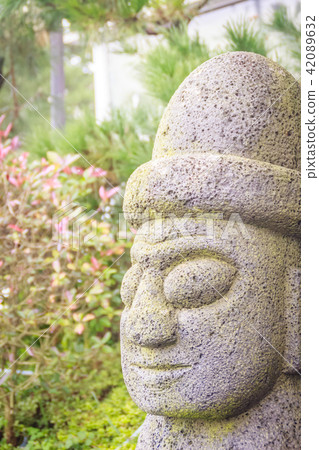 Close up face of the stone idol (Dolharubang) 42089632