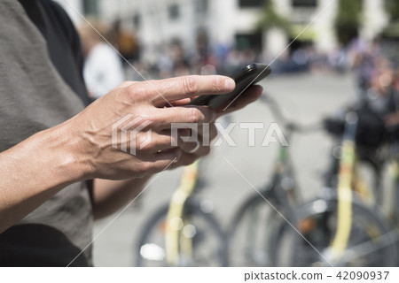 man using smartphone on the stree man using smartphone on the stree 42090937