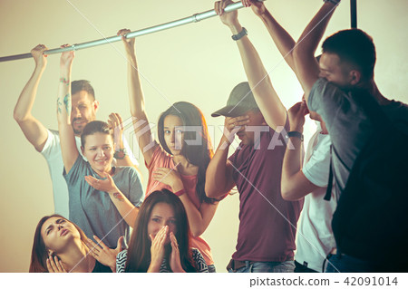 Sweaty armpits. Sweaty man. Bus. Public transport. The unhappy people near man 42091014
