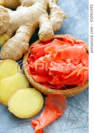 Slices of pickled and fresh ginger. Slices of pickled and fresh ginger. 42091085