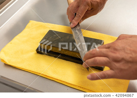 Knife sharpening Knife sharpening 42094867