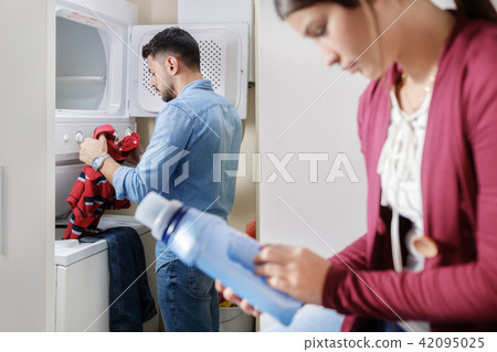 Man And Woman Doing Chores Washing Clothes Man And Woman Doing Chores Washing Clothes 42095025
