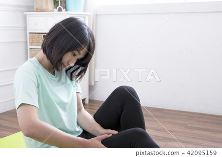Sore woman after exercise 42095159