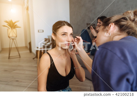 cute, young girl doing makeup cute, young girl doing makeup 42100218