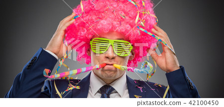 Funny businessman in pink wig 42100450