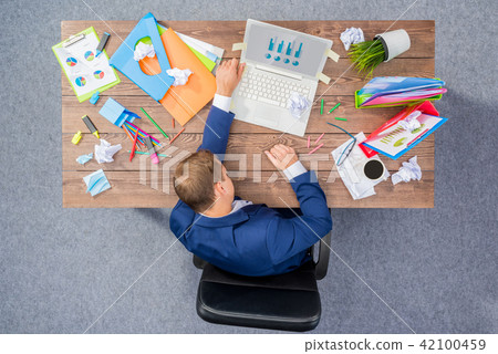 Overworked businessman Overworked businessman 42100459