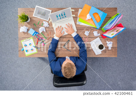 Overworked businessman Overworked businessman 42100461