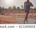 Blurred image of black men runner are running 42100668