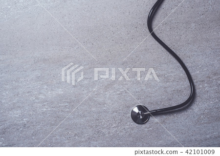 Stethoscope on gray stone background 42101009