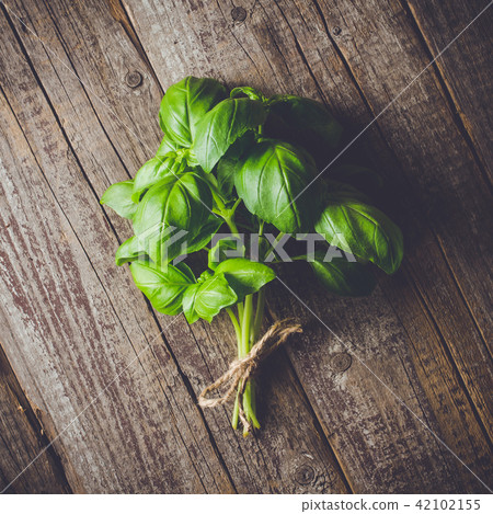 Fresh herbs from garden on an old table Fresh herbs from garden on an old table 42102155