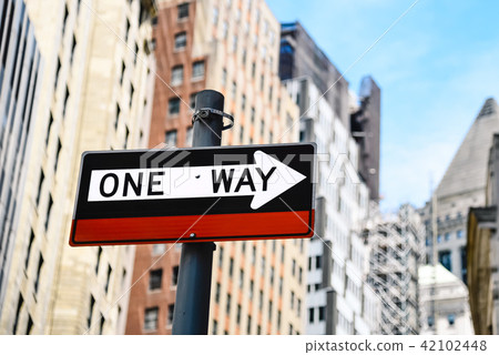 Low angle view of directional sign against buildings in New York Low angle view of directional sign against buildings in New York 42102448