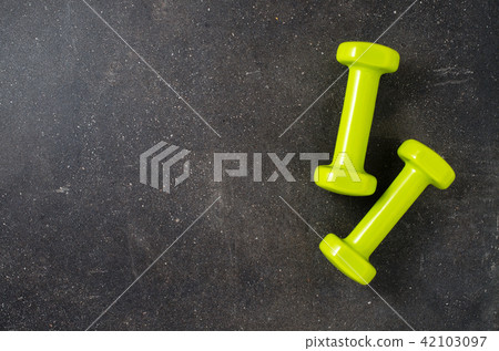 Fitness equipment on dark background Fitness equipment on dark background 42103097