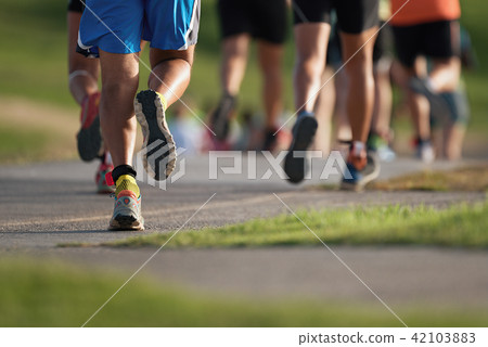 Marathon running in the light of evening 42103883