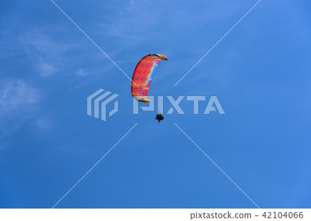 Paragliding extreme Sport with blue Sky and clouds 42104066