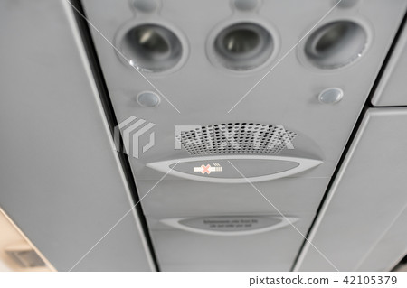 Air condition unit and lighting of aerospace on the ceiling of passenger cabin. Modern Airplane 42105379