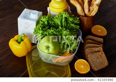 Healthy lunch prepared in small plastic container, top view, close-up. 42105990